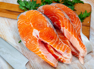 Food preparation, fresh raw salmon fillet on wooden table