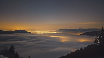 Obraz premium Nightfall over the Mountains: A City Lightscape Hidden in Clouds