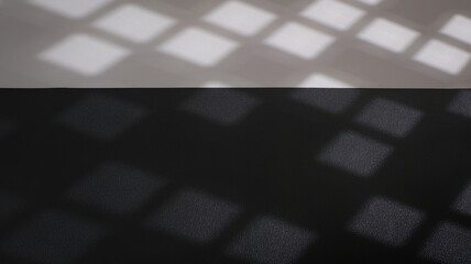 Black and white leather texture background with window shadow of geometric squares. Backdrop shadows for customized message
