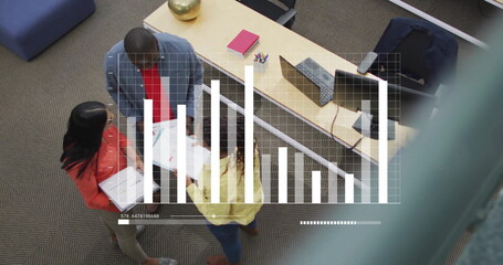 Image of diagrams over diverse colleagues discussing work