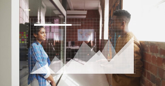 Image of diagrams over diverse colleagues discussing work