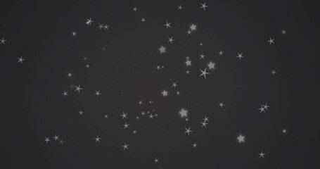 Naklejka premium Image of white stars moving on black background