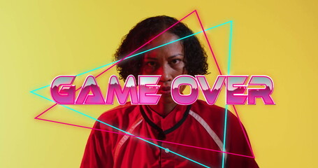 Image of game over text over african american female rugby player on yellow background