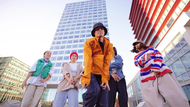 Energetic Breakdancer Showcasing a Skillful Freeze Move while Friends Support and Cheer him on during an Exciting Street Dance Performance with Enthusiasm and Passion for hip hop Culture. Vertical