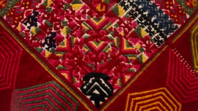 A colorful patchwork quilt with a black and white design