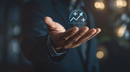 Businessman holds a virtual hologram displaying positive business growth and financial success icons