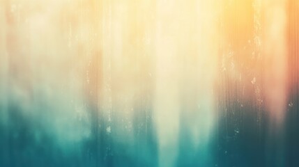 Abstract blurred background with teal, orange, and yellow hues.