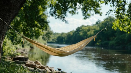 Riverbank hammock relaxation, summer nature scene, peaceful getaway
