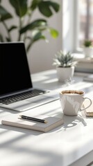 Minimalist workspace with laptop and coffee cup in sunlit office