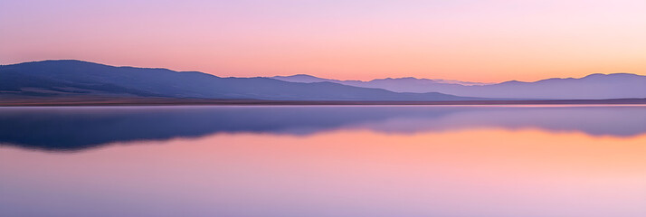 Obraz premium Serene Landscape at Dusk Reflecting Tranquil Waters and Mountain Silhouettes, Evoking a Sense of Onward Journey and Peace