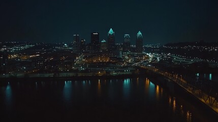 18.A stunning nighttime view of Cincinnati&acirc;&euro;&trade;s downtown district, with a vibrant skyline illuminated by city lights. The towering buildings and sleek skyscrapers reflect the glow of streetlights and