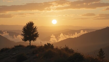 Obraz premium Golden Hour Mountain Majesty: A Solitary Tree at Sunset