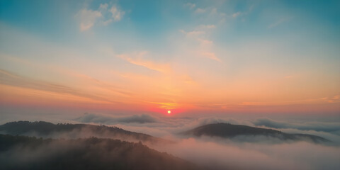Fototapeta premium Colorful abstract of a sunrise over misty hills, dreamy and serene in ultra-HD.