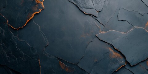 Naklejka premium Textured dark stone surface with glowing edges and intricate patterns. Dark stone background with unique textures and orange color details.