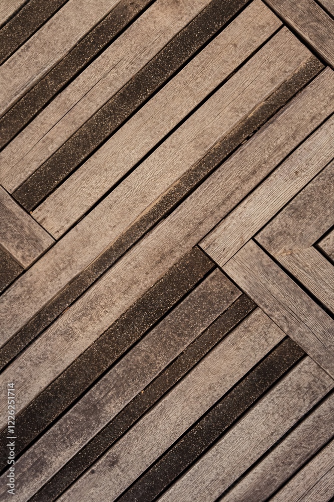 Poster Weathered wooden planks in a herringbone pattern create a rustic background texture