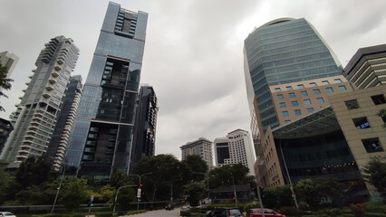 tall buildings mixed with greeneries in downtown area Singapore