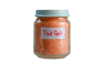 Glass jar of pink salt isolated on a transparent background. Selective focus