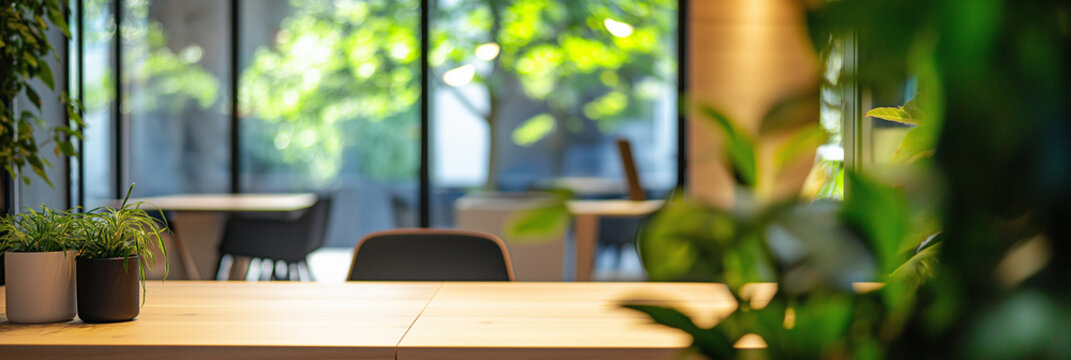 Blurred background of a modern coworking space showcasing sleek black furniture and abundant natural light. ideal for productivity and collaboration in a stylish environment.