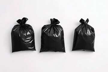 A top-down view of three small trash bags on a white background. (Generative AI)
