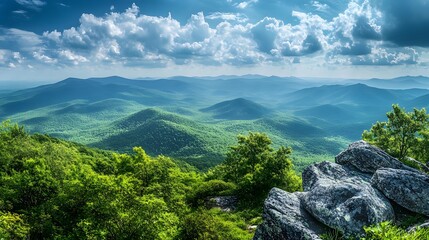 A secluded mountaintop with a sweeping view of surrounding peaks and valleys