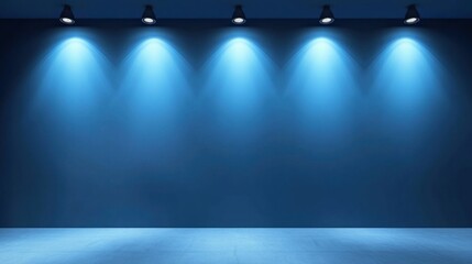 Blue wall with spotlights, empty space.