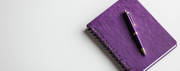 Purple notebook and pen on a white background with empty space for text