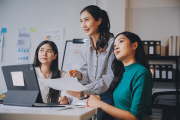Group of young asian creative business brain storm meeting presentation,discussing roadmap to product launch, planning,strategy,new business development,working with new startup project in office.