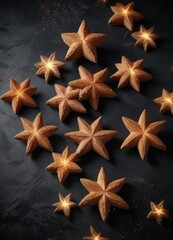 Cinnamon stars in a random arrangement on a dark background with a hint of sparkle , shiny details, geometric shapes, festive atmosphere