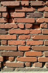 Obraz premium A Detailed View of an Aged Brick Wall with Imperfect Mortar and Some Missing Bricks