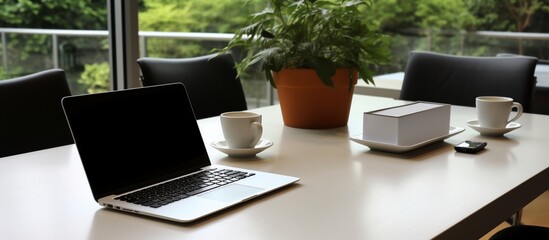 Fototapeta premium Modern Office Workspace: Laptop, Coffee, and Tranquility