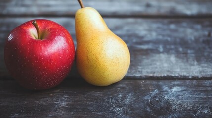 Red apple and yellow pear on rustic wood.  Food photography for blogs, websites, or recipe books
