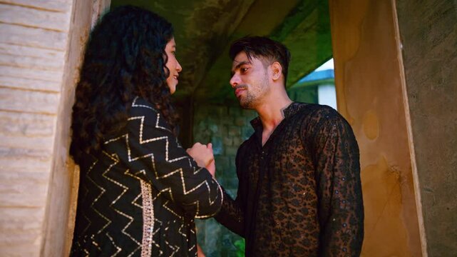 Couple stands dating intimately in forgotten place