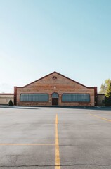 Empty Retro Bowling Alley Captured Across a Parking Lot Under Blue Sky