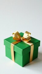 Obraz premium Wooden green Christmas gift box on white background with golden ribbon tied in a bow, wooden, decoration, holiday