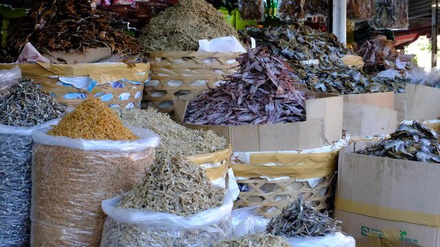 Close-up of dried fish stacks at Carbon Market, Philippines, showcasing local seafood trade, traditional food preservation, and cultural market scenes.