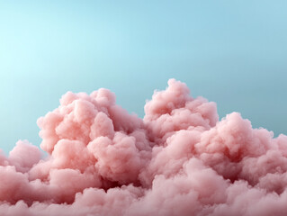 Fluffy pink clouds floating against a blue sky