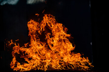 Fire blaze flames on black background. Fire burn flame isolated, abstract texture. Flaming explosion effect with burning fire.