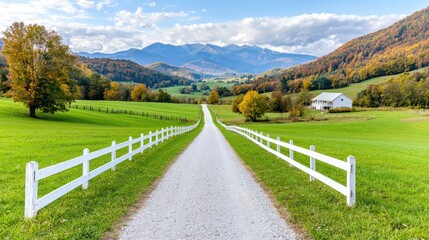 Scenic autumn country road leading to farmhouse in valley. Ideal for travel brochures