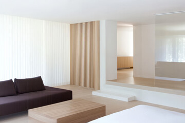 Fototapeta premium Modern minimalist interior design featuring natural wood and neutral tones in a spacious living area