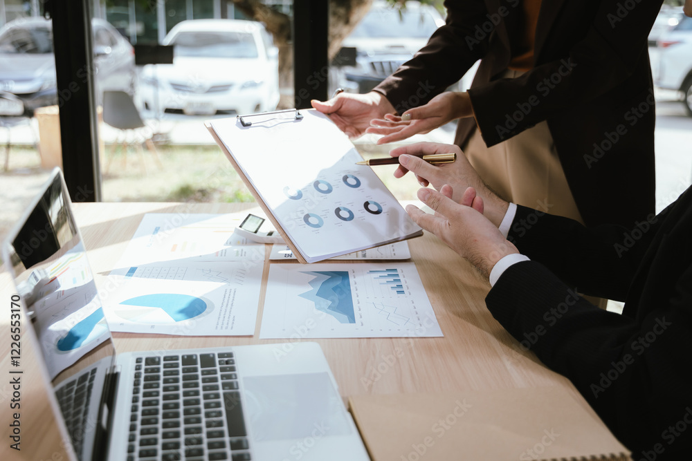 Sticker Businesswoman analyzing financial data on her laptop in modern office. Charts, graphs and reports show investment strategies, budgets and stock market trends.