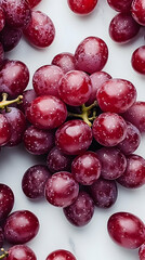 Fototapeta premium Red grapes scattered on marble, overhead shot, food photography, perfect for recipe blogs
