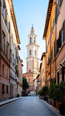 Roman church tower viewed down narrow street, sunny day.  Ideal for travel brochures