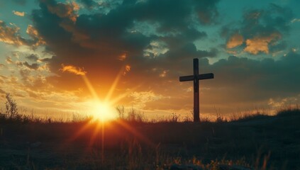 Fototapeta premium The cross on the hill with beautiful sunset sky in the background