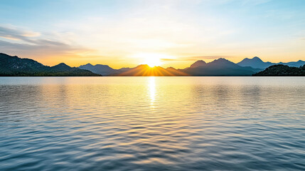 Naklejka premium serene sunrise reflected in calm lake, surrounded by mountains