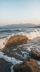 Fototapeta premium Serene Ocean Waves Crashing on Rocky Shore Coastal Landscape