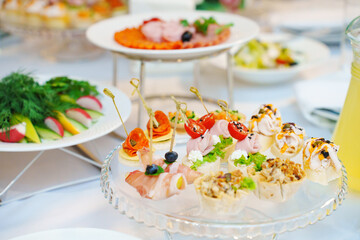 A plate of canapes on a served festive table. catering for a holiday.