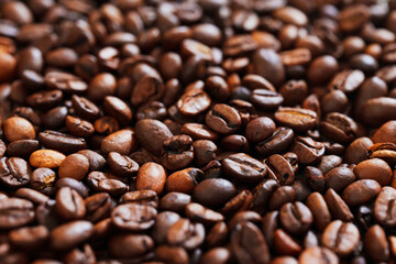 background. roasted beans of natural coffee. raw materials for coffee shops, coffee machines.