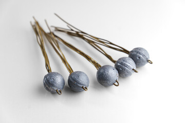 Old lead fishing sinkers on a white background. fishing tools.