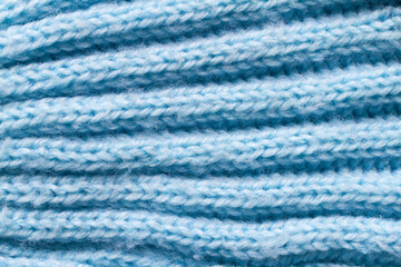 Blue wool fabric texture close-up. Warm knitted fabric.
