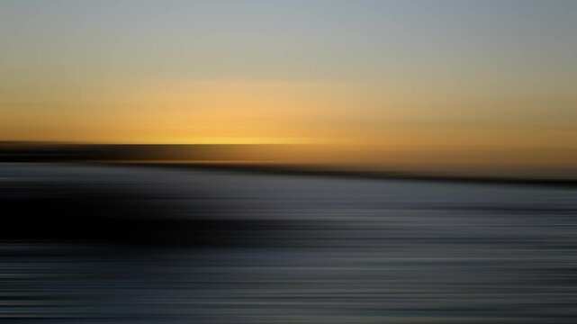 Abstract sunset background with horizontal motion blur, blending warm golden tones and dark gradients, evoking tranquility and calm, perfect for modern travel or cinematic visuals.